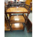 A 19th century galleried three tier what not on bobbin turned supports