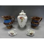 Five Staffordshire copper lustre jugs together with a Royal Albert Old Country Roses vase and cover