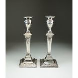 A pair of Victorian silver mounted candlesticks, Charles Stuart Harris, London 1898,