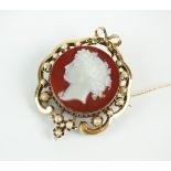 A late 19th century hardstone cameo, enamel and seed pearl brooch,