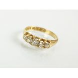 An 18ct gold Victorian five stone graduated diamond ring,