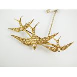 An early 20th century seed pearl swallow brooch,