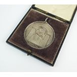 A silver long service medal, awarded to 'Elias Davies', 1932,