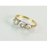 A three stone graduated diamond ring,