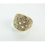 A diamond dress ring, designed as a tapering diamond set plait,