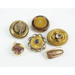 A collection of five late 19th century brooches,