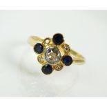 An 18ct gold diamond and sapphire cluster ring,