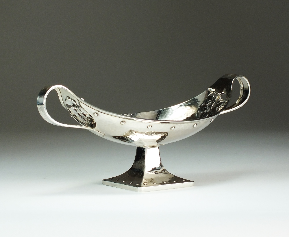 An Arts & Crafts two handled silver navette shaped bowl, G L Connell Ltd, Birmingham 1911,