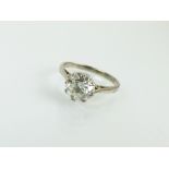 A single stone diamond ring, the brilliant cut diamond within eight claw setting,