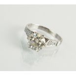 An 18ct white gold single stone diamond ring, the brilliant cut diamond within six claw mount,