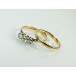 A graduated three stone diamond ring,