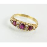 An 18ct gold nine stone ruby and diamond ring,