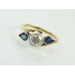 A 9ct gold three stone diamond and sapphire ring,