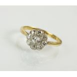 An early 20th century diamond floral cluster ring,