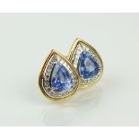 A pair of sapphire and diamond stud earrings,
