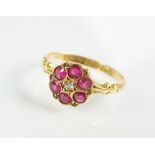 An early 20th century 18ct gold ruby and diamond floral cluster ring,