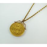 A Victoria Jubilee head £2 coin pendant, with scrolling mount, suspended from yellow metal chain,