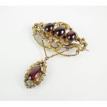 A mid-19th century garnet set brooch,