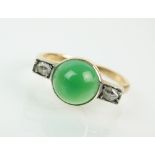 A green stone and diamond cluster ring,
