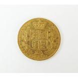 A Victoria shield back sovereign, dated 1864,