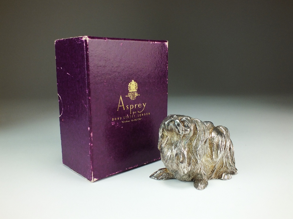 An Asprey & Co silver model of a Pekingese dog, London 1986, naturalistically modelled,