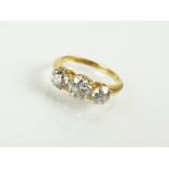 A graduated three stone diamond ring,