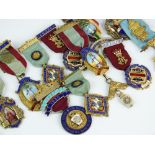 A collection of seventeen silver, silver gilt and polychrome enamel Masonic medallions,