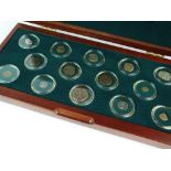 A cased set of fourteen ancient Greek world coin collection, silver and bronze,