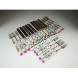 A set of twenty-two Victorian silver porcelain handled knives and forks,