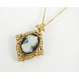 A late 19th century hardstone cameo and seed pearl pendant,