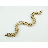 A 9ct gold bracelet, with stylised bar and openwork links, weight 39.