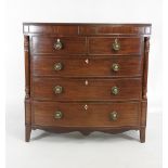 A William IV mahogany bow front chest of two short over three long graduated cockbeaded drawers