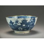 A Caughley slop bowl transfer-printed with the Uninhabited Pagoda pattern with additional gilding,