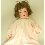 A bisque headed doll by Heubach hoppelsdorf, the head impressed 320-6 1/2 Germany,