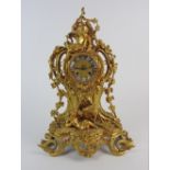 A Louis XV style ormolu mantel clock with 3.