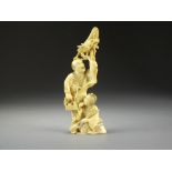 A Japanese ivory okimono of street entertainers, Meiji period,