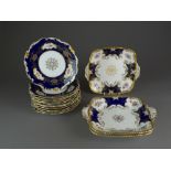 A set of twelve Coalport cobalt blue and florally painted dessert plates with three Coalport blue