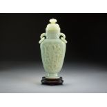 A Chinese celadon jade vase and cover, late Qing Dynasty,