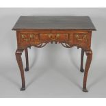 An 18th century style oak lowboy,