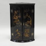 An 18th century Japanned bowfront wall hanging corner cabinet,