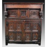 A late 17th century joined oak court cupboard the upper section with two lozenge carved cabinet