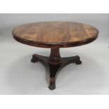 A Regency rosewood circular centre/breakfast table on a reeded tapering column and tripartite