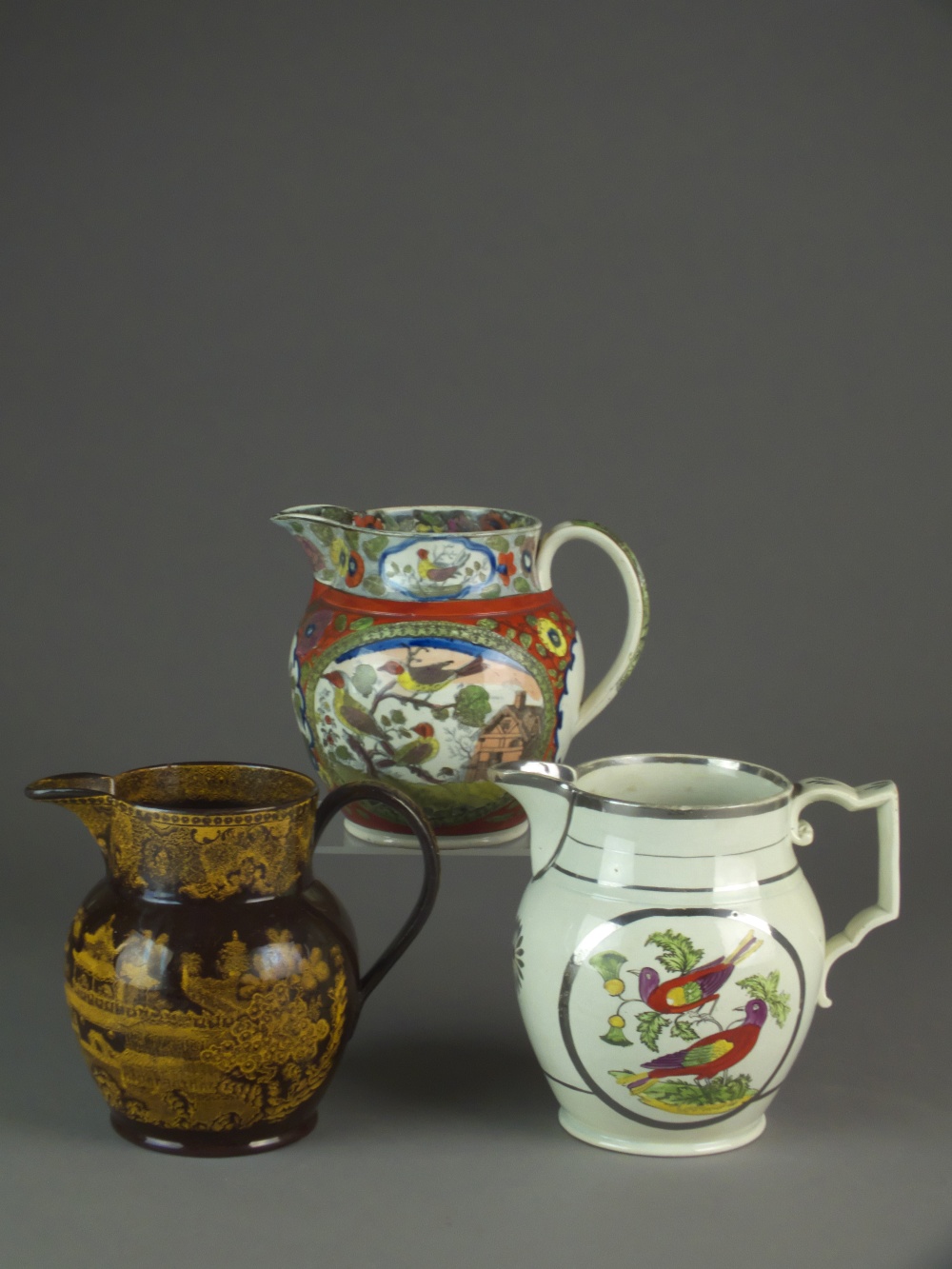 Three mid-19th century English pearlware jugs,