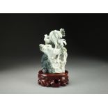 A Chinese mottled green jadeite carving of cockerels, late 20th Century,