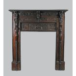 A 17th century style oak fire surround and overmantel the rectangular mirror over a lunette carved