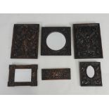 Two 19th century oak Arts and Crafts panel each of leaf and berry design, 48.5cm x 35.