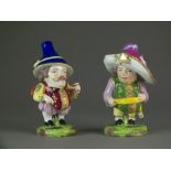 A pair of Derby porcelain mansion house dwarves, 19th century, painted red mark, 16.