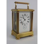 A brass carriage clock, the 2.