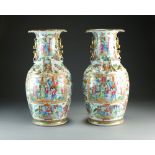 A pair of Chinese Canton famille rose vases, 19th Century, of ovoid form with lobed everted rims,