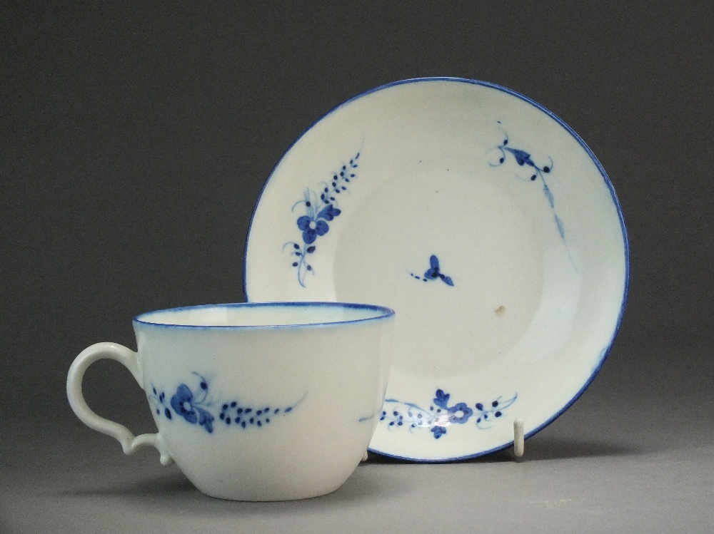 A Caughley tea cup and saucer painted with the Chantilly Sprig B pattern, circa 1786-94, S mark,